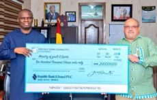 Sports Minister receives ¢200k cheque from Republic Bank